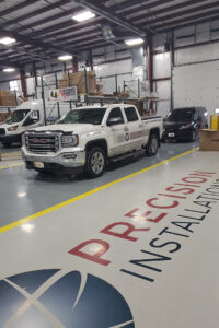Precision Installations company vehicle inside service bay Precision Installations company vehicle inside service bay