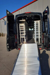 Custom metal shelving and loading ramp installed inside commercial van Custom metal shelving and loading ramp installed inside commercial van