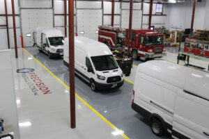 Cargo vans and emergency vehicles being upfitted at workstations Cargo vans and emergency vehicles being upfitted at workstations