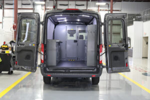 Commercial van with custom bulkhead and Adrian Steel storage inside workstation Commercial van with custom bulkhead and Adrian Steel storage inside workstation