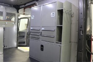 Custom bulkhead, flooring and Adrian Steel shelving unit with locks inside commercial van Custom bulkhead, flooring and Adrian Steel shelving unit with locks inside commercial van