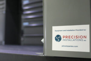 Precision Installation logo inside metal storage door Precision Installation logo inside metal storage door