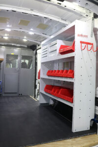 Weather Guard custom shelving with plastic bins installed in commercial van Weather Guard custom shelving with plastic bins installed in commercial van