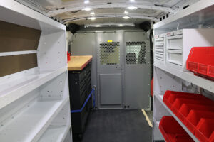 Custom metal shelving, storage, flooring and bulkhead inside commercial van Custom metal shelving, storage, flooring and bulkhead inside commercial van