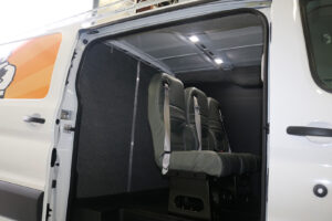 Fabricated commercial van bulkhead with three seats installed inside Fabricated commercial van bulkhead with three seats installed inside