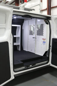 Custom commercial van upfitting with shelving and Weather Guard bulkhead Custom commercial van upfitting with shelving and Weather Guard bulkhead
