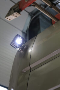 Custom LED lighting on the outside of a dark green vehicle Custom LED lighting on the outside of a dark green vehicle