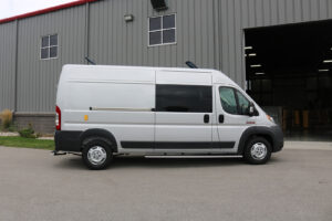 Customized upfitting for work van parked outside of workstation Customized upfitting for work van parked outside of workstation