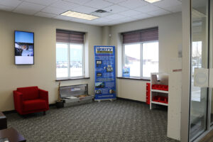 Precision Installation lobby waiting area with Verity banner and Weather Guard products Precision Installation lobby waiting area with Verity banner and Weather Guard products